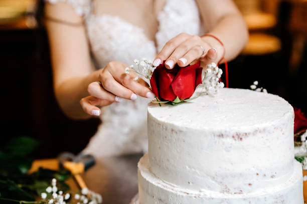 Roses around of a wedding cake with beautiful pink background and lighting