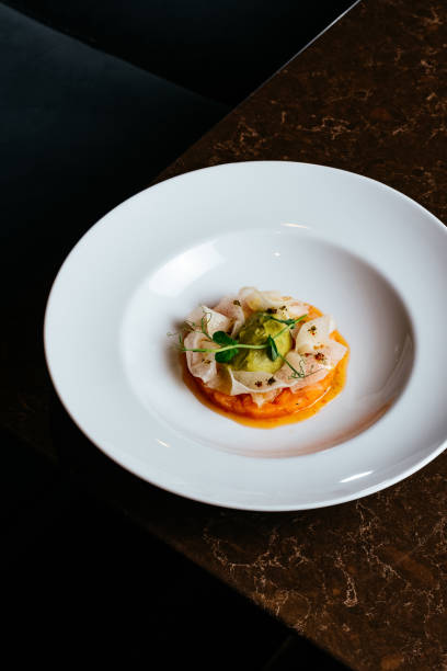 istock salmon carpaccio with sauce and crispy chips 1450709867