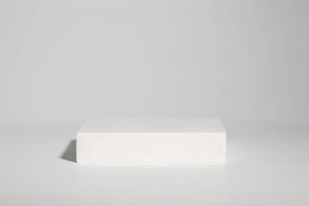 istock White plaster pedestal or podium for product show 1450711672