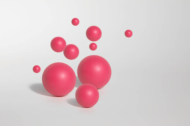istock Mockup of several pink spheres on white background 1450712571