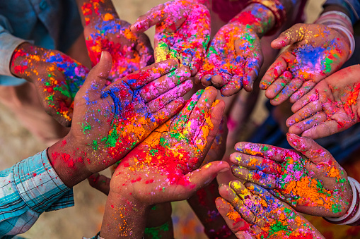 Colors of India -  Indian children playing colorful powders during holi, India