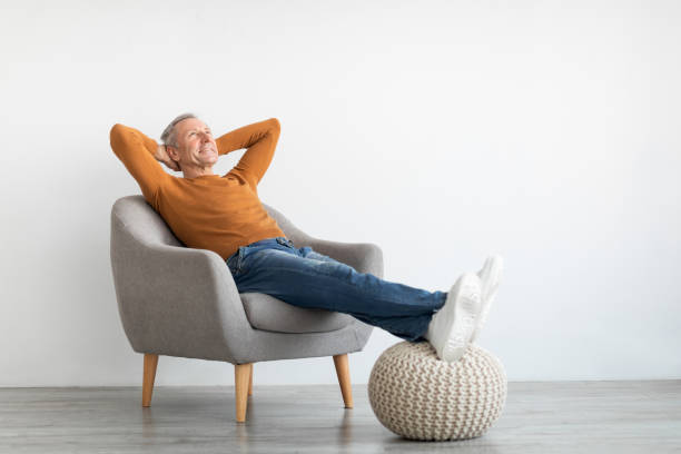 istock Mature man having rest at home on the chair 1450718201