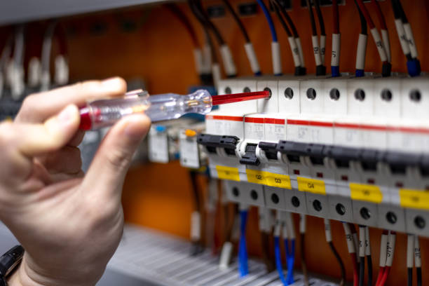 istock Engineer hand is using electric screwdriver to inspect electrical system in repair and maintenance concept. 1450719902