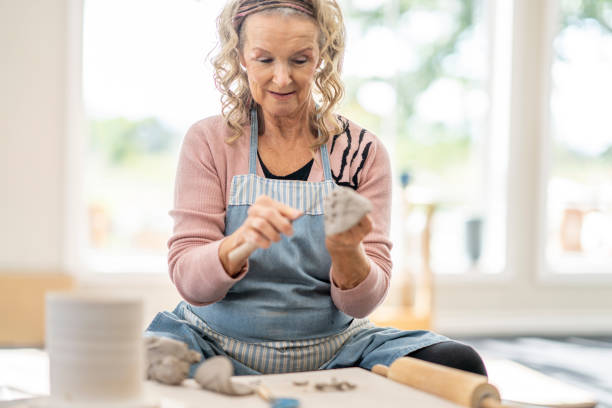 istock Senior Woman Working with Clay 1450721429
