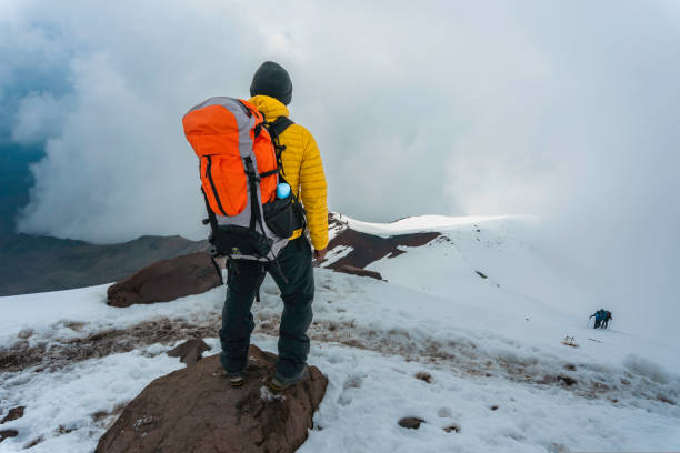 istock Tourist with a backpack and mountain panorama 1450735069