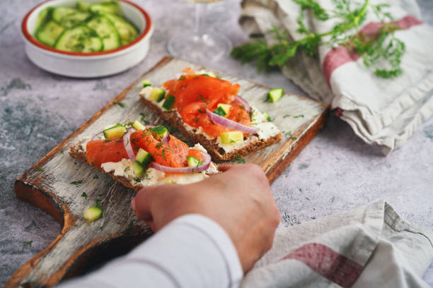 istock Salmon with Cottage Cheese and Cucumber on Toasted Bread 1450742942