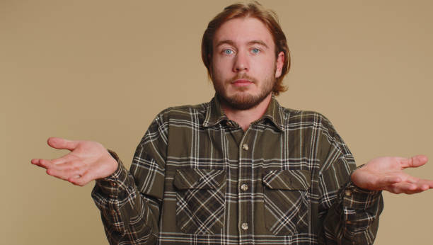istock Man raising hands in indignant expression asking why what reason of failure demonstrating disbelief 1450744524