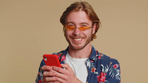 istock Tourist man using smartphone show thumbs up like, positive feedback, recommends wifi connection 5G 1450744640