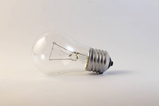 istock old incandescent bulb lies on a white background 1450748054