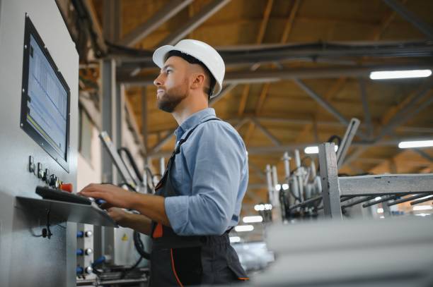 istock Factory worker. Man working on the production line. 1450750212