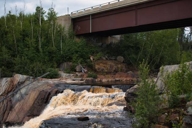 istock Metal bridge over the river in Quebec, Canada 1450753276