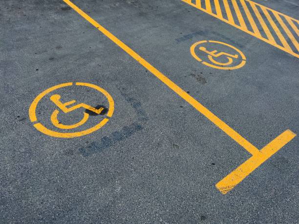 istock Parking lot with handicaped signs 1450753925