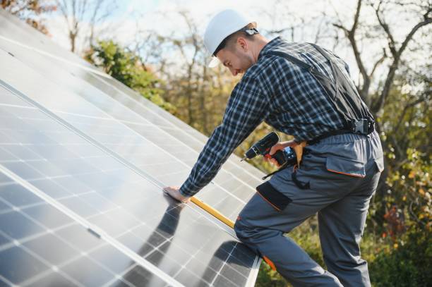 istock Men technicians installing photovoltaic solar moduls. Concept of alternative and renewable energy. 1450757619