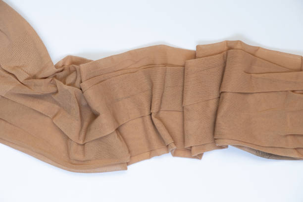 istock women's nylon tights on a colored background close-up 1450757856