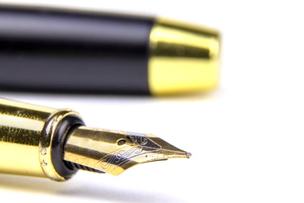 istock Golden fountain pen isolated on a white background 1450758826