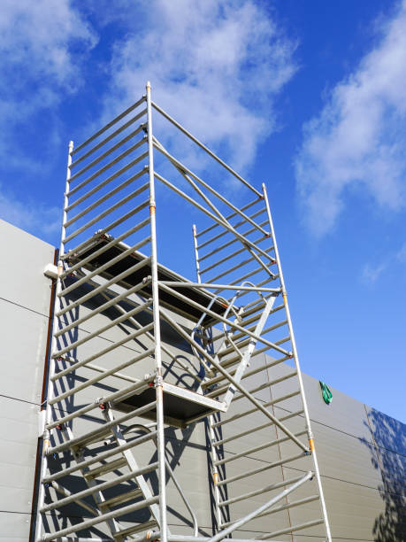 istock Modern metal tubular multilevel scaffolding next to the sandwich panel facade 1450761604
