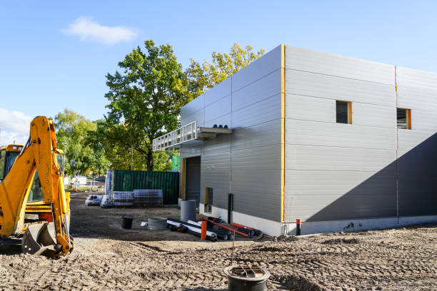 istock Gray sandwich panel facade of a unfinished warehouse building 1450761665