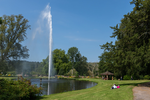 Chard.Somerset.United Kingdom.September 4th 2021.The centenary fountain is spraying water into the air in the Mermaid pond at Forde Abbey in Somerset