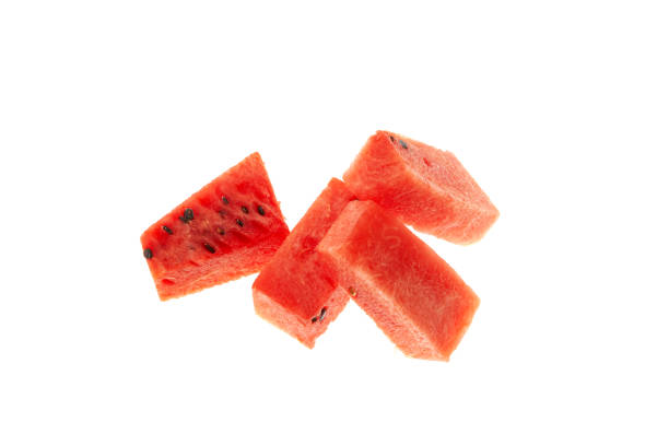istock Watermelon pieces on white background, close-up, selective focus. Sugary watermelon pulp cubes with seeds 1450766461