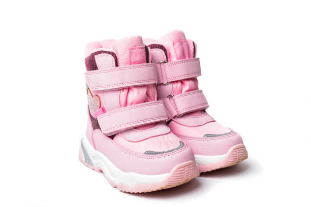 Pink kids warm winter boots with foam soles. stock photo