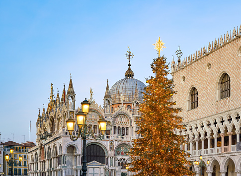 Venice, Veneto Italy - December 18, 2022  Christmas tree in St. Mark's square with Doge's Palace and St Mark's Basilica