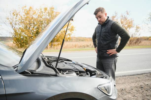a man feel stress because his car is broken down.