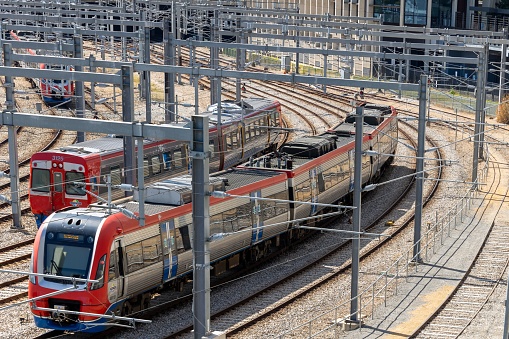 Greenwith, Australia – October 16, 2022: The electric trains passing each other at the Adelaide Rail Yard