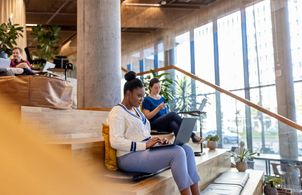 istock African woman working on laptop at creative coworking space 1450789023