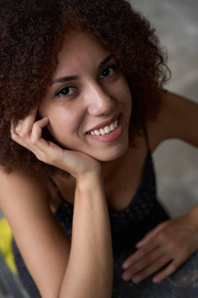 istock Adorable young woman smiling and looking contented 1450803898
