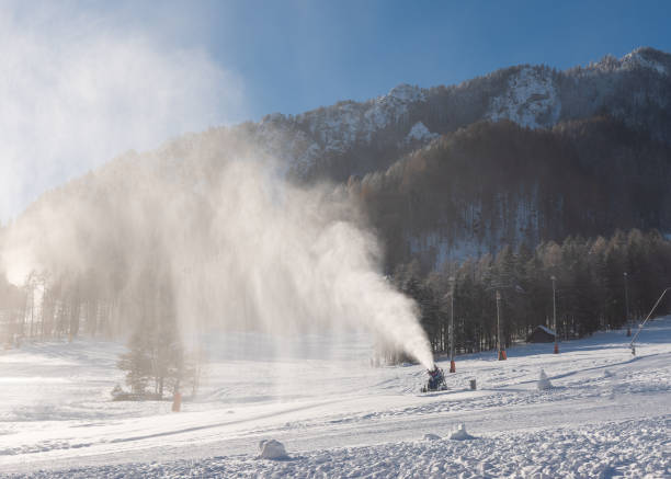 istock Snowmaking machine snow cannon or gun in action 1450807190