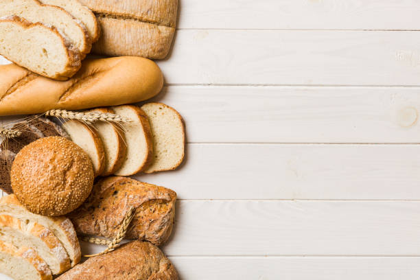 istock Homemade natural breads. Different kinds of fresh bread as background, top view with copy space 1450809647