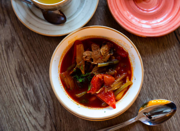 Traditional dish of Kazakhstan cuisine - thick spicy laghman with lamb meat, vegetables and noodles