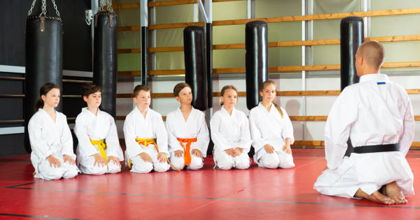 istock Children with their male instructor posing in karate class 1450811670