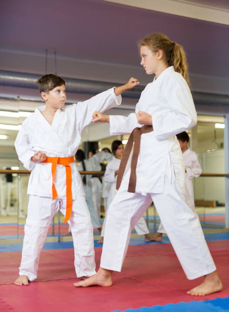 istock Karate kids training in gym 1450812356