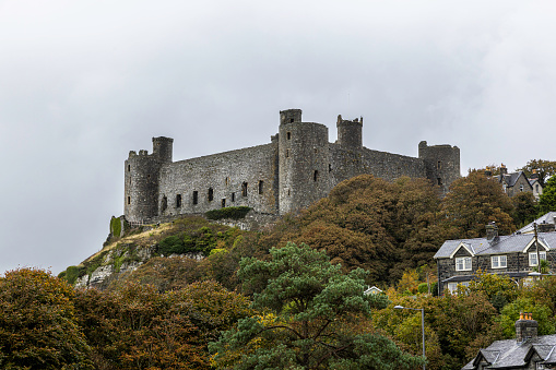Harlech Castle in Harlech, Gwynedd, Wales, is a medieval fortification built onto a rocky knoll close to the Irish Sea. It was built by Edward I during his invasion of Wales between 1282 and 1289.