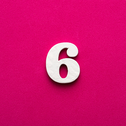 Number 6 - White wooden number on rhodamine red background