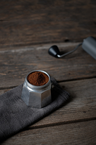 Moka pot and Coffee grinder on wood