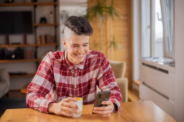 istock Happy young woman using phone 1450837945