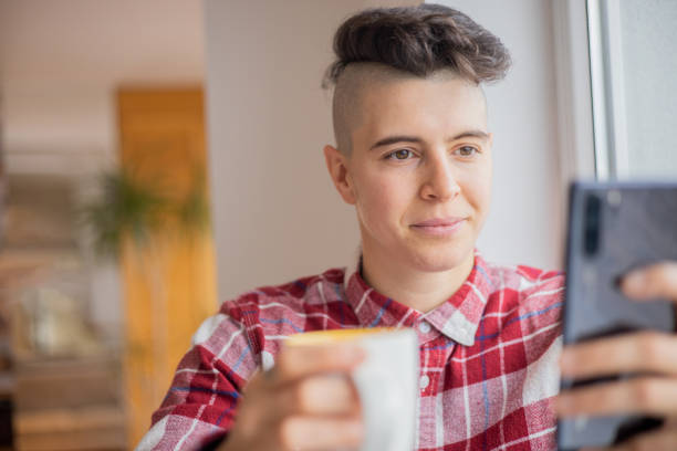 istock Happy young woman using phone 1450837959