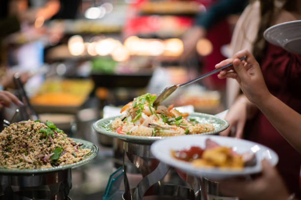istock scooping the food, catering, dinner time 1450839028