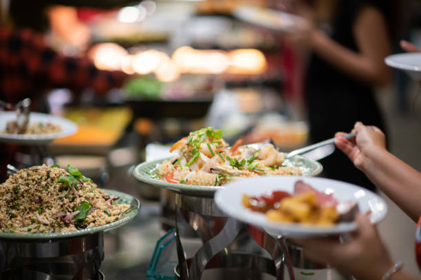 istock scooping the food, catering, dinner time 1450839052