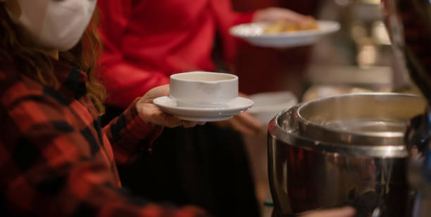 istock scooping the food, catering, dinner time 1450839056