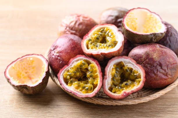 istock Passion fruit in basket on wooden background 1450858953