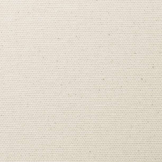 istock Muslin fabric cloth woven texture background light white cream color 1450859010