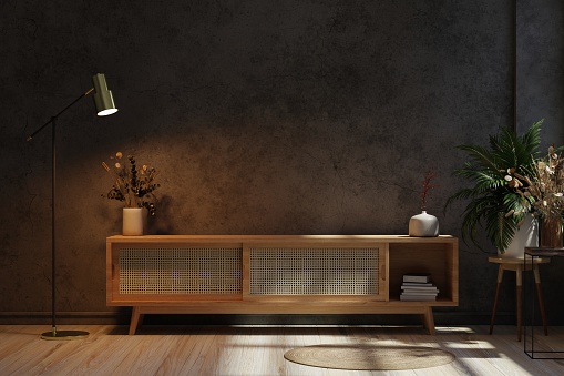 Cabinet mockup for TV in living room at night the concrete wall.3d rendering