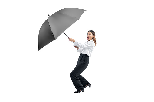 Asian businesswoman holding black umbrella isolated over white background
