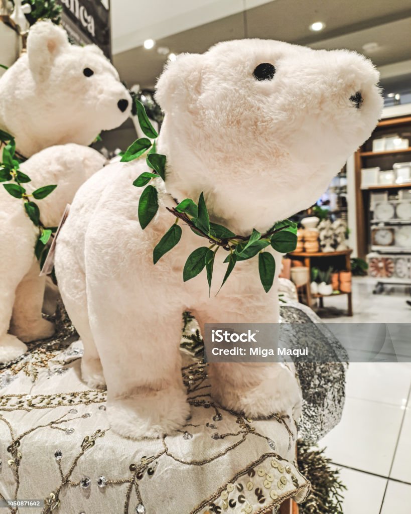 Christmas stuffed polar bear. Teddy bear in a big store. Peluche de oso polar navideño en tienda grande. Christmas Stock Photo