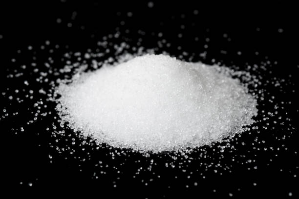 istock Food quality citric acid E330 isolated on black 1450873464