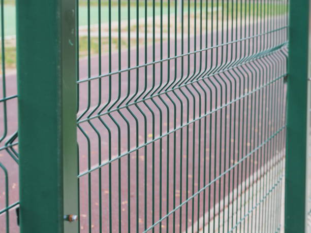 istock The green railing of the stadium 1450879673