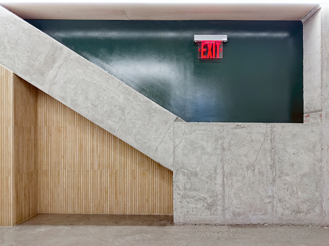 Modern concrete office detail with exit sign